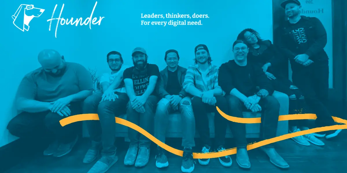 Group photo of Hounder team members sitting and smiling with the tagline “Leaders, thinkers, doers. For every digital need.”