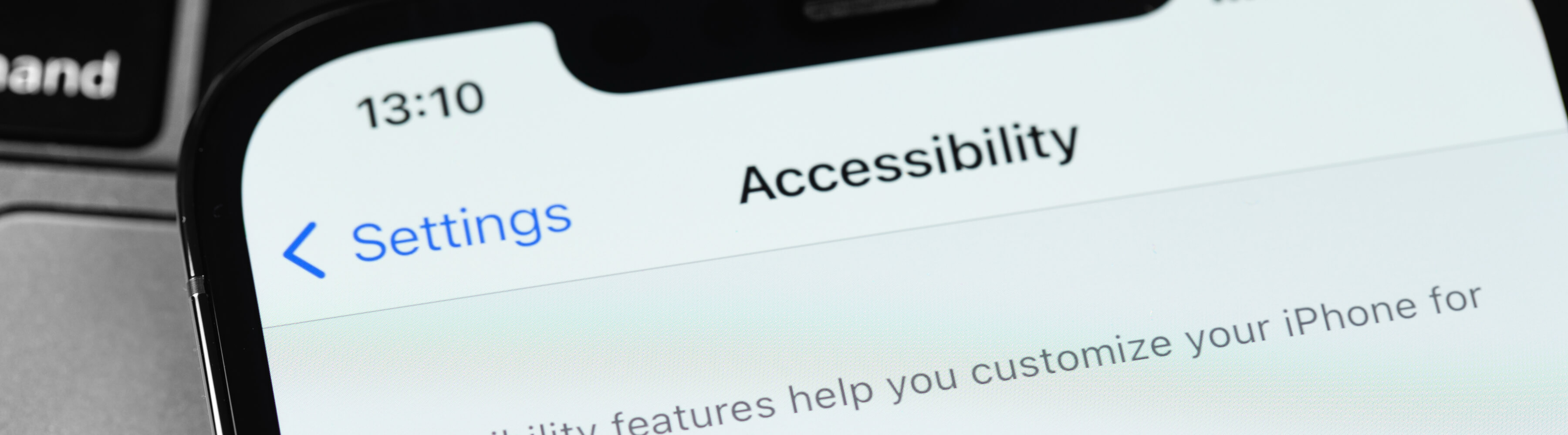 Close-up of a smartphone screen showing the Settings and Accessibility menu.