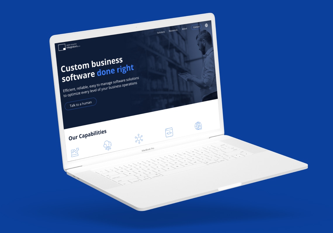 Laptop displaying a custom business software website on a blue background.