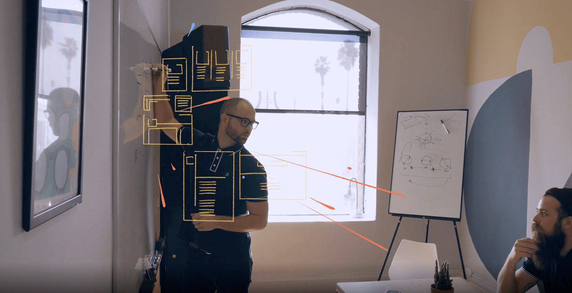 Man presenting holographic data in modern office setting.
