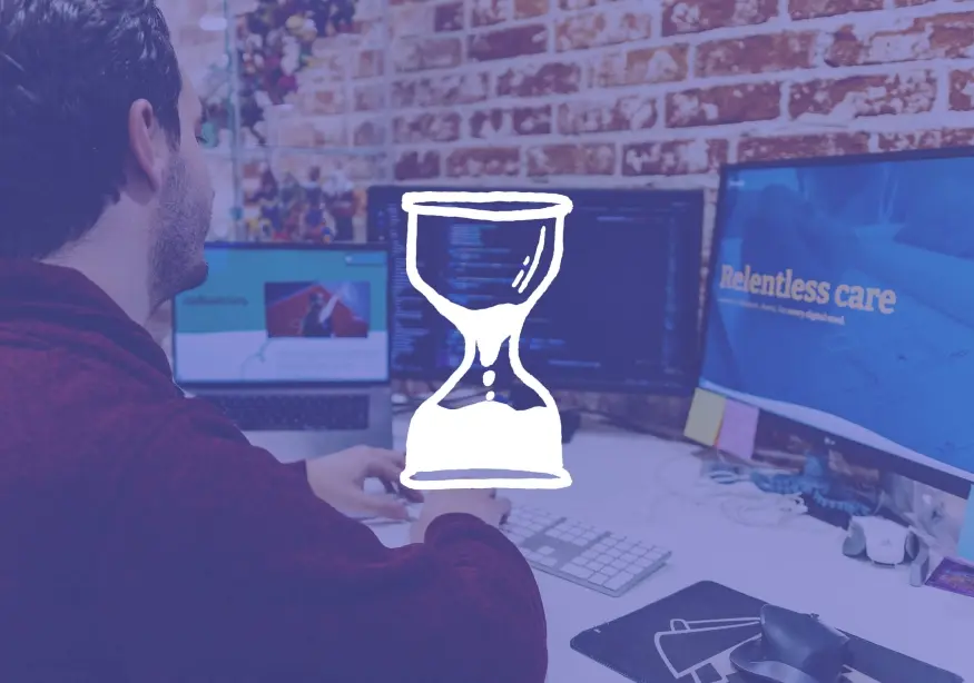 Man working at a computer with a screen displaying "timeless care."