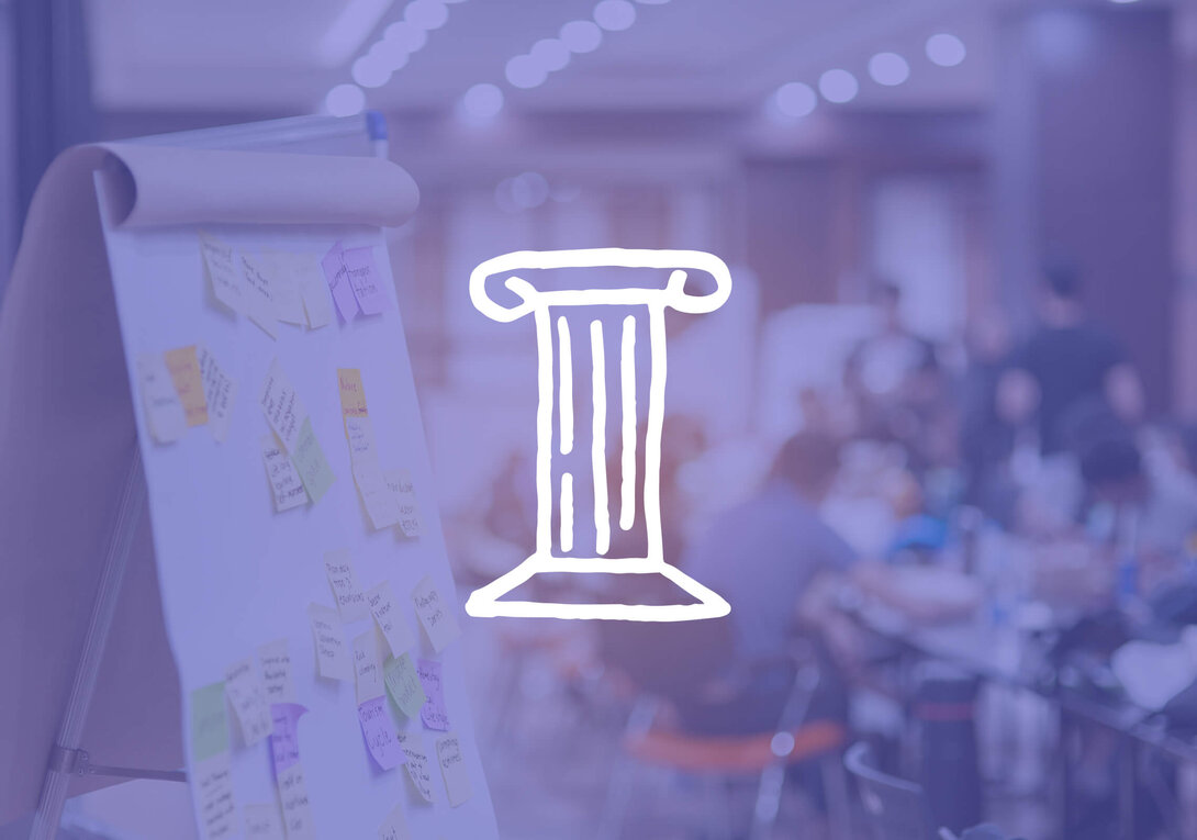 Whiteboard and easel in a blurred conference setting. Large column graphic overlay.