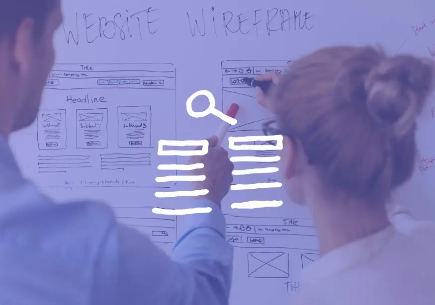 Two people sketching website wireframes on a whiteboard.