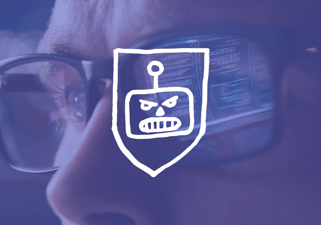 Robot face on shield reflects in eyeglasses, blue toned.