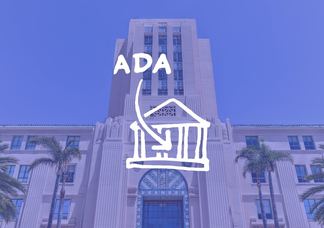 Urban building with palm trees and ADA symbol overlay.