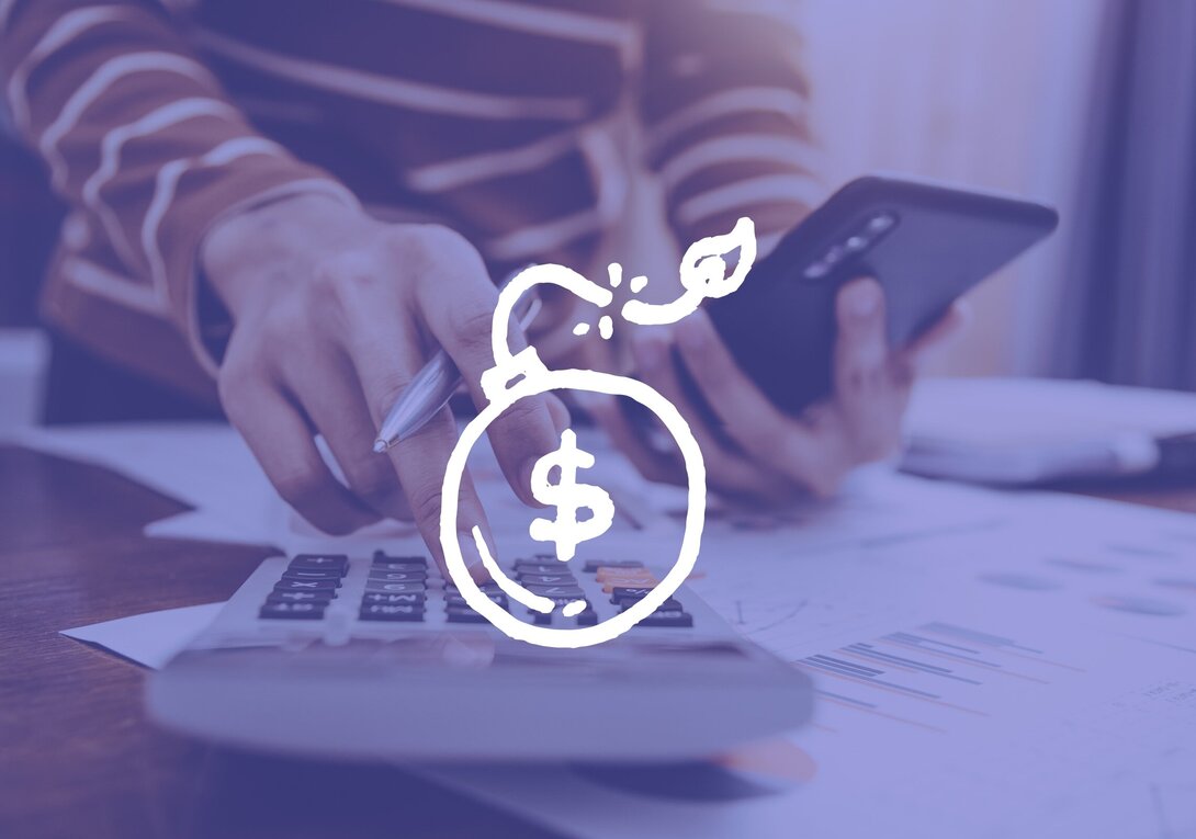 Hands using calculator and smartphone, dollar sign graphic overlay.