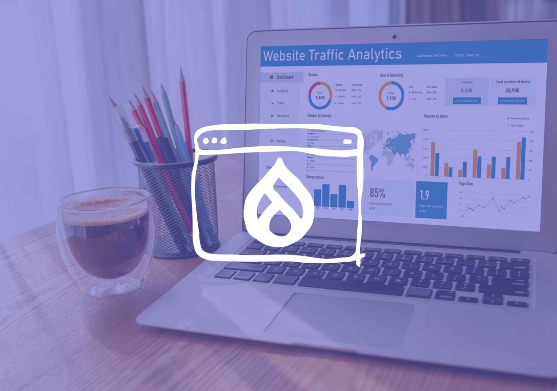 Laptop displaying website traffic analytics with coffee and pencils nearby.