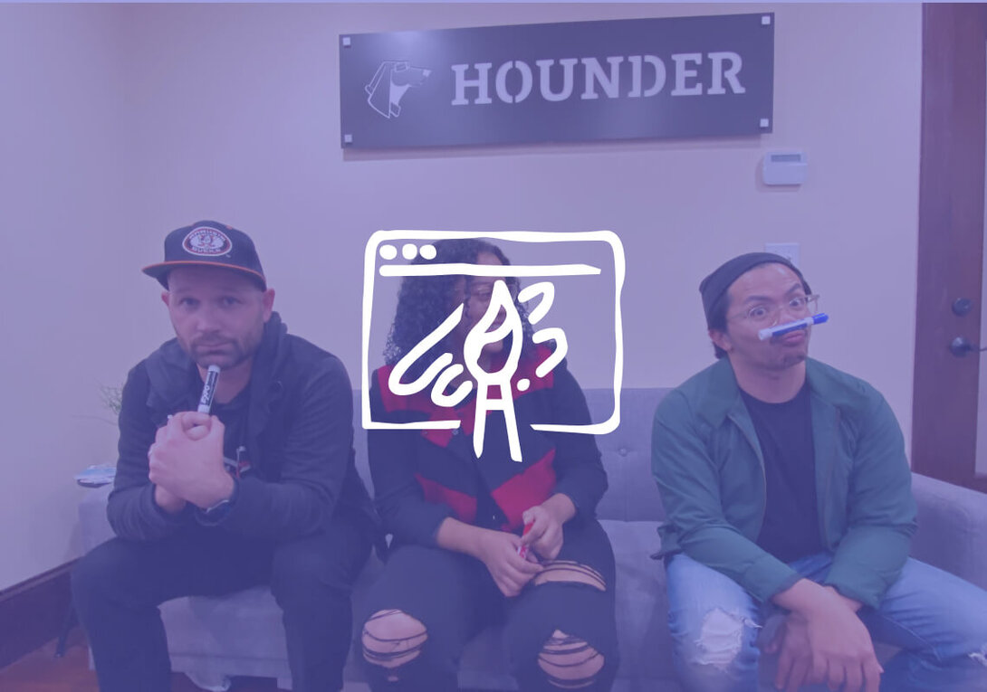 Three people sitting on a couch with a playful, creative vibe.