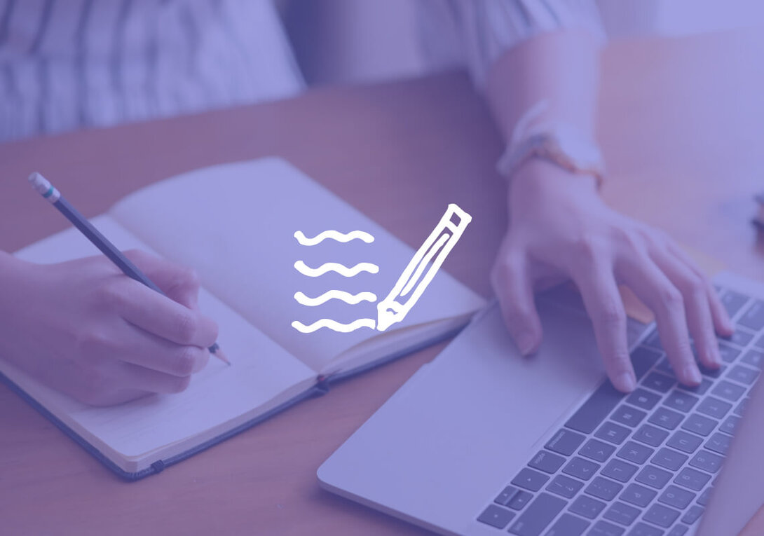 Person writing in notebook and using laptop with illustrated pen icon.