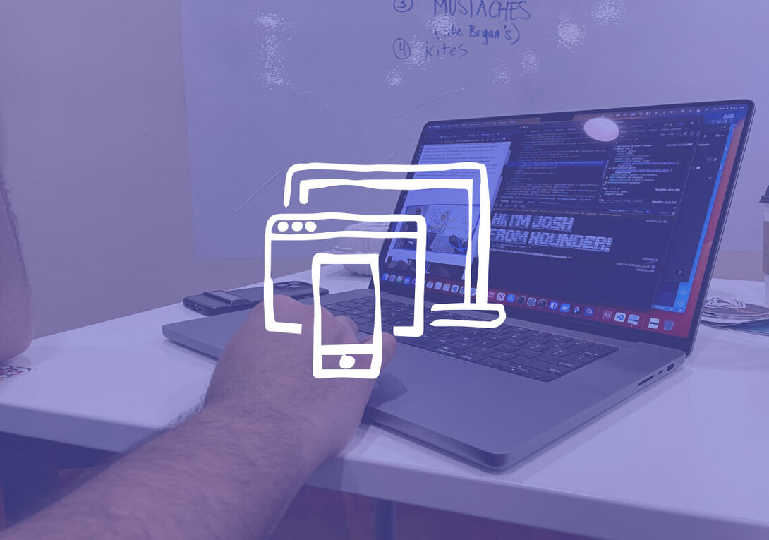 Person working on code and design on a laptop in a cafe setting.