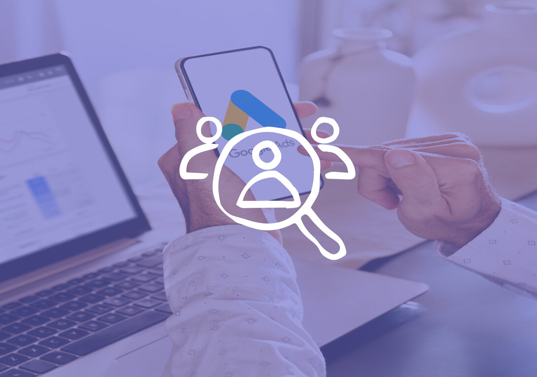 Person using Google Ads on smartphone with laptop in background.