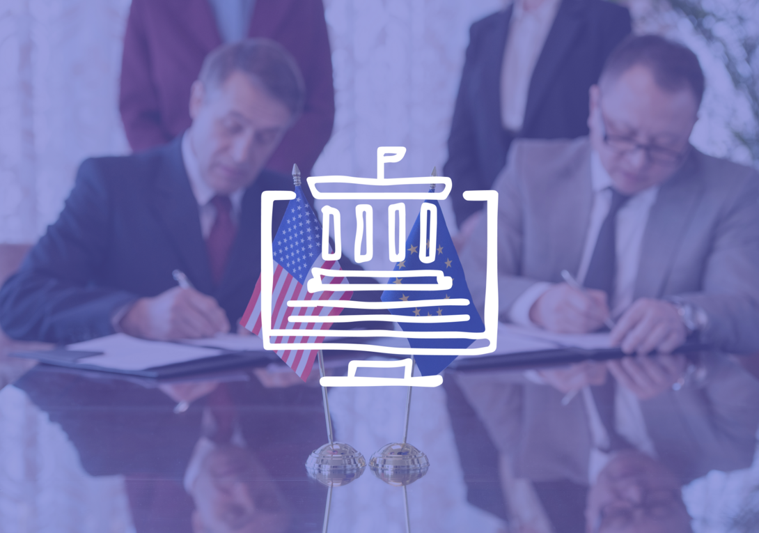 Leaders sign international agreement, with U.S. and E.U. flags on table.